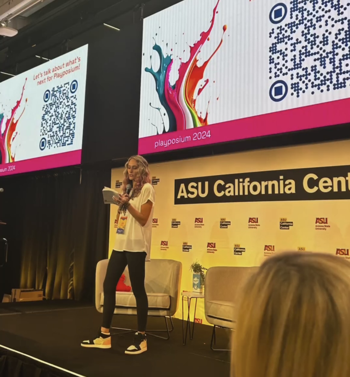 Lisa Forbes speaking on stage at Playposium